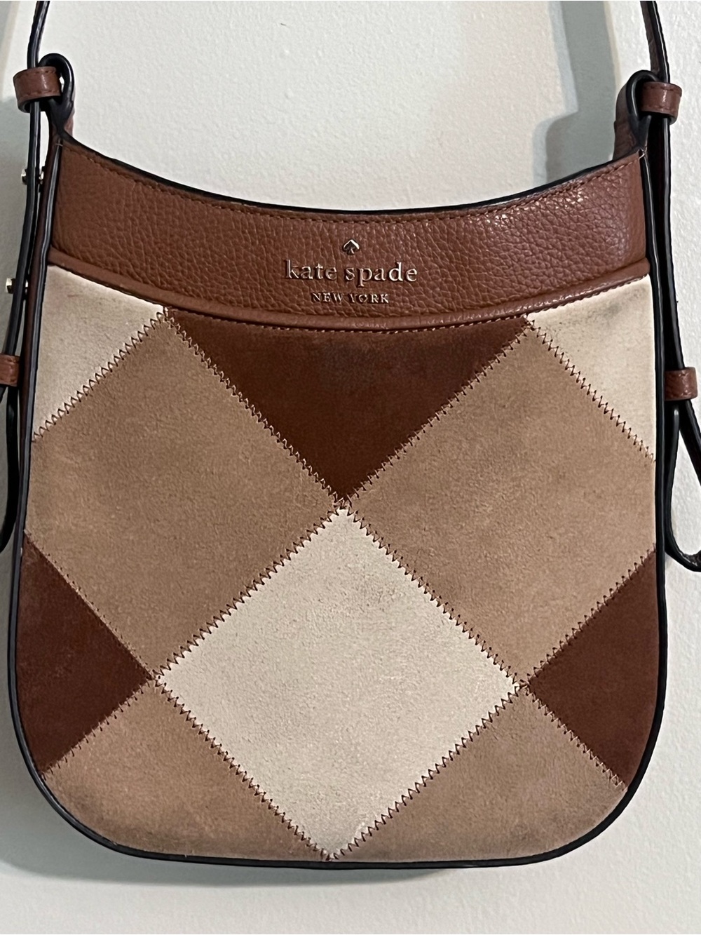 Kate Spade Leila North South Crossbody in a warm gingerbread suede patchwork des